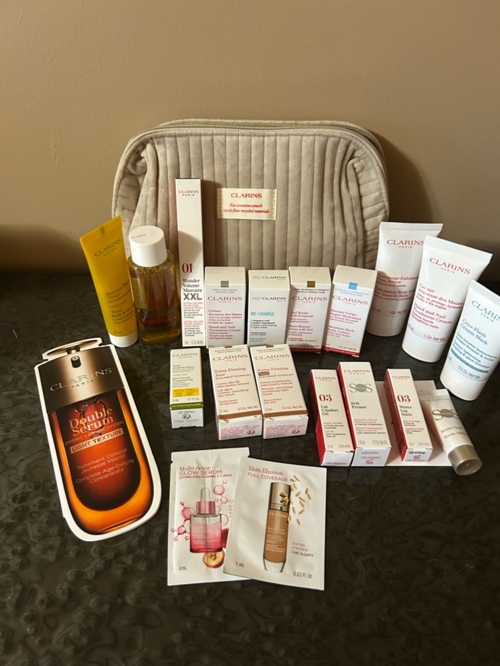 Clarins Skincare Set with Beige Quilted Cosmetic Pouch